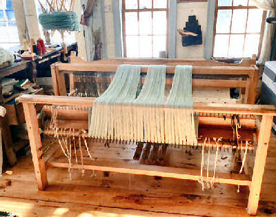 Inside Phyllis's well lighted shop showing her loom.